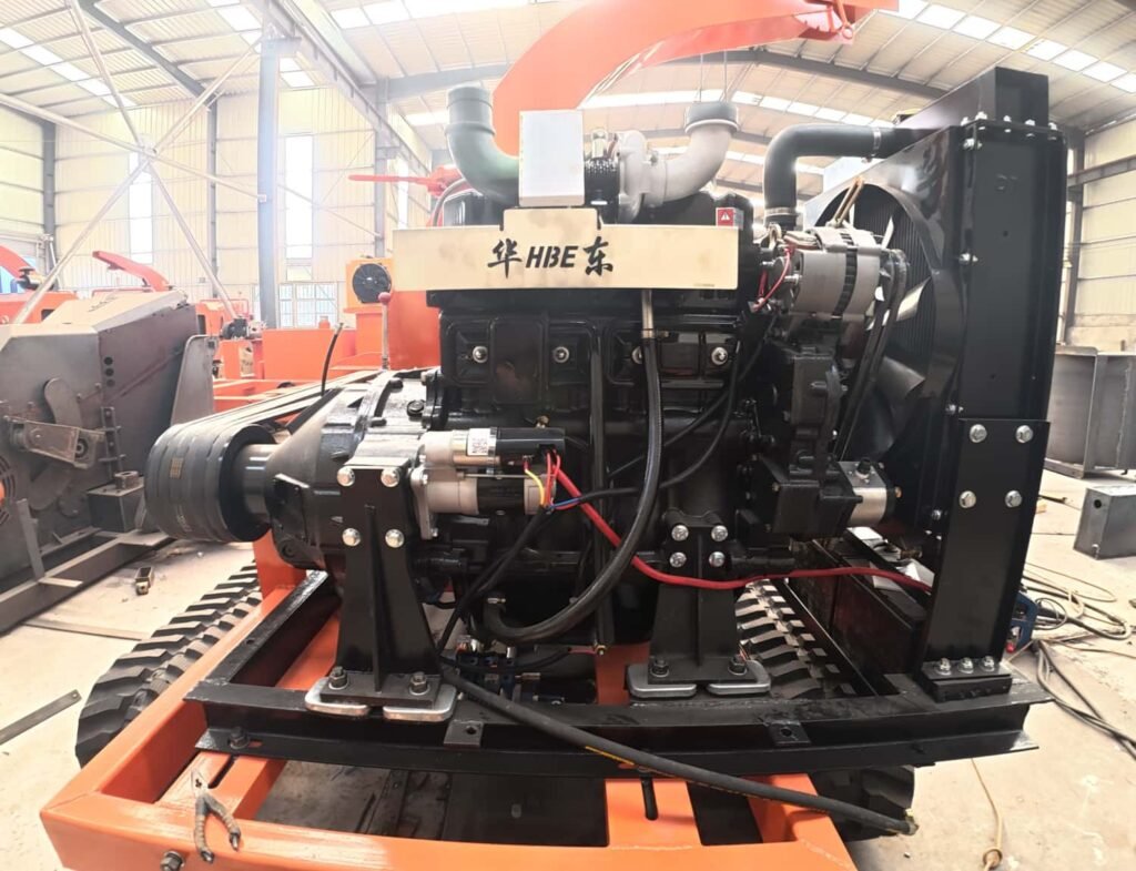 Close-up of diesel engine fitted on crawler self-propelled wood chipper, power unit for mobile branch shredder