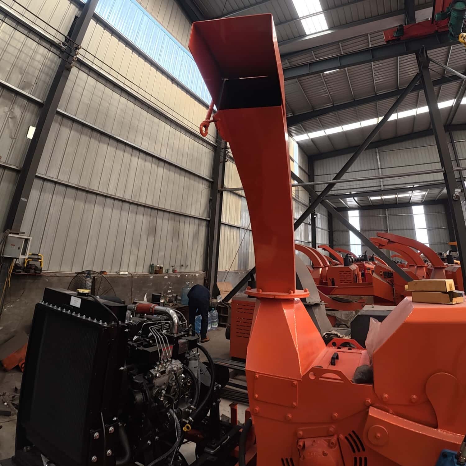 Crawler mobile wood chipper and finished wood chips, crushed branches used for biomass raw material and garden mulch